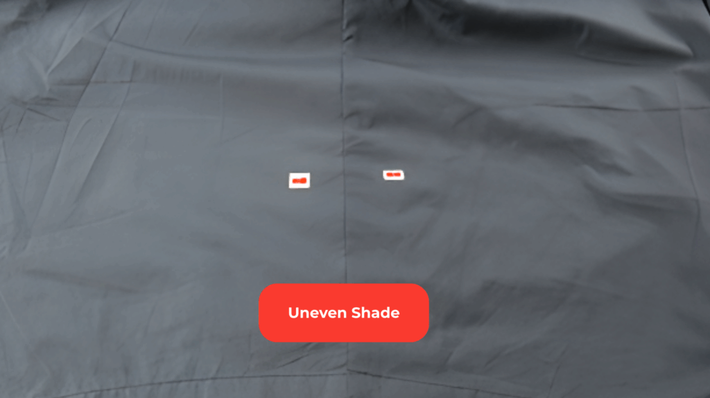 Garment defects with shade variation, showing one panel lighter and the other darker on the same clothing item.