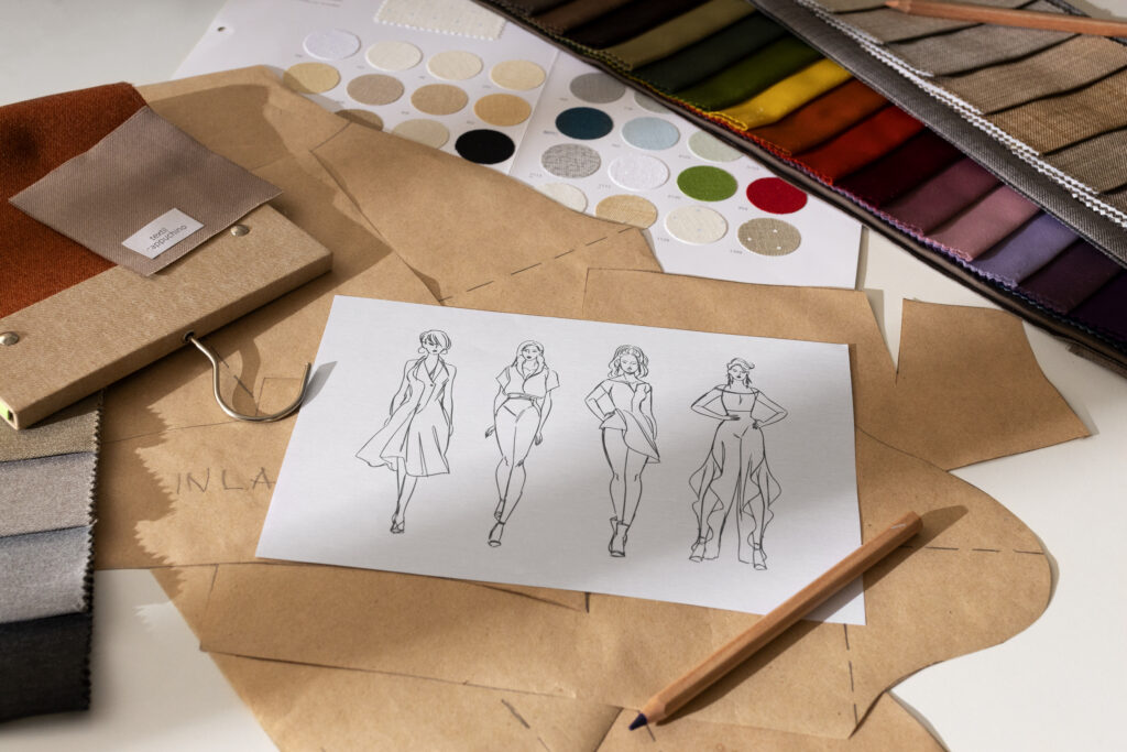 Apparel sampling workspace showing fabric swatches, sewing tools, and prototype garment patterns