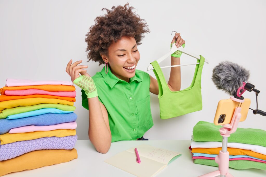Influencer live streaming with bright color outfit, illustrating rapid fashion trend cycles among Gen Z and Gen Alpha fashion behavior
